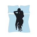 Silhouette of a couple lying together top view