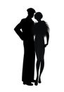 Silhouette of couple retro style 20s or 30s. Man wearing cap and flapper girl wearing fur stole, isolated on white background Royalty Free Stock Photo