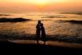 Silhouette of couple about to kiss on beach Royalty Free Stock Photo