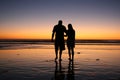 Silhouette of couple walking in sunset Royalty Free Stock Photo