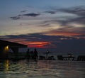 The silhouette of couple watching sunset on the beach Royalty Free Stock Photo