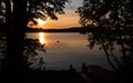 Silhouette of a couple watching the sunset over the lake Umbagog in  New Hampshire USA Royalty Free Stock Photo