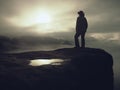 Silhouette of a cow girl or cowboy stay on edge and watching