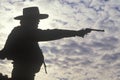 Silhouette of Cowboy aiming pistol Royalty Free Stock Photo