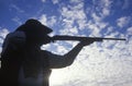 Silhouette of Cowboy aiming rifle