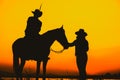 Silhouette Cowboy and horse with sunset