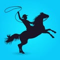 Silhouette of cowboy with lasso riding on horse Royalty Free Stock Photo