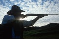 Silhouette of cowboy with rifle