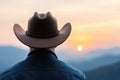 Silhouette of a cowboy watching the sunset Royalty Free Stock Photo