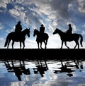 Silhouette cowboys with horses Royalty Free Stock Photo