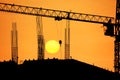 Silhouette crane on building construction site