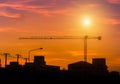 Big crane on building construction site with sunset Royalty Free Stock Photo