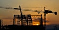 Silhouette crane building and sunset