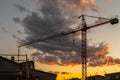 Silhouette of a crane at a construction site at sunset Royalty Free Stock Photo