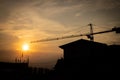 Silhouette crane construction site on sunset time background Royalty Free Stock Photo