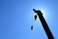 silhouette crane truck on clear blue sky for construction background Royalty Free Stock Photo