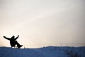 Silhouette of Crazy man enjoy a sleigh ride. Man sledding. Funny man play outdoors in snow Royalty Free Stock Photo