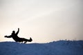 Silhouette of Crazy man enjoy a sleigh ride Royalty Free Stock Photo