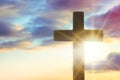 Silhouette of cross against beautiful sky at sunrise. Christian religion Royalty Free Stock Photo