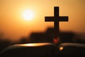 Silhouette of cross and bible with the sunset as background, christian concept, spirituality and religion Royalty Free Stock Photo