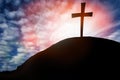 Silhouette cross on Calvary mountain sunset background. Easter concept Royalty Free Stock Photo