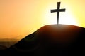 Silhouette cross on Calvary mountain sunset background. Easter concept Royalty Free Stock Photo