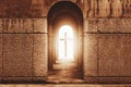 Silhouette of the cross at the end of tunnel with ray of light Royalty Free Stock Photo