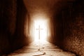 Silhouette of the cross at the end of tunnel with ray of light Royalty Free Stock Photo