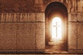 Silhouette of the cross at the end of tunnel with ray of light Royalty Free Stock Photo