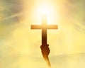 Silhouette the cross in hand, religion symbol in light and landscape Royalty Free Stock Photo