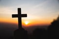 Silhouette the cross in hands, religion symbol in light and landscape over a sunrise, background, religious, faith concept Royalty Free Stock Photo