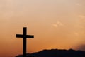 Silhouette of cross on mountain at sunset. concept of religion Royalty Free Stock Photo