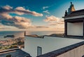 Wall and backlit silhouette of Our Lady of Peace Chapel with ocean sunset, SÃÂ£o Miguel - Azores PORTUGAL