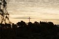 Silhouette of the cross at the San Cristobal de Alcoi hermitage with cloud landscape during sunrise Royalty Free Stock Photo