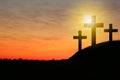 Silhouette of crosses on hill at sunset, space for text