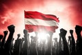 Silhouette of a crowd of people with the flag of Austria, Silhouette of raised arms and clenched fists on the background of the