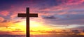 Silhouette of crucifix cross at sunset sky.