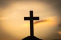 Silhouette of crucifix cross at sunset time with holy and light background Royalty Free Stock Photo