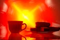 Silhouette of a cup of tea and a plate of biscuits Royalty Free Stock Photo