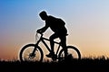 A silhouette of a cyclist