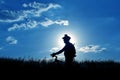 Silhouette of a cyclist with a bike in the sun Royalty Free Stock Photo