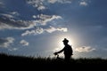 Silhouette of a cyclist with a bike in the sun Royalty Free Stock Photo