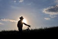 Silhouette of a cyclist with a bike in the sun Royalty Free Stock Photo