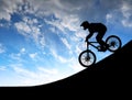 Silhouette of the cyclist on downhill bike Royalty Free Stock Photo