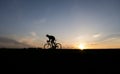 Silhouette of cyclist in motion on the background of beautiful sunset. Male ride bicycle in sun set. Silhouette of man Royalty Free Stock Photo