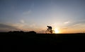 Silhouette of cyclist in motion on the background of beautiful sunset. Male ride bicycle in sun set. Silhouette of man Royalty Free Stock Photo