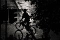 Silhouette of a Cyclist in the Rain