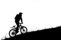 Silhouette of cyclist riding uphill Royalty Free Stock Photo