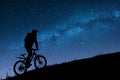 Silhouette of cyclist riding uphill at night Royalty Free Stock Photo