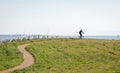 The silhouette of the cyclist on road bike at midday Sport and active life concept sunset time. A man riding on bicycle in a park Royalty Free Stock Photo